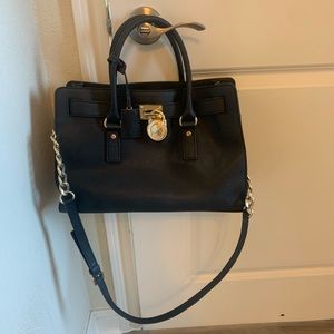 Michael Kors black and gold purse good condition